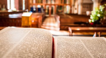 Image of a bible in a church